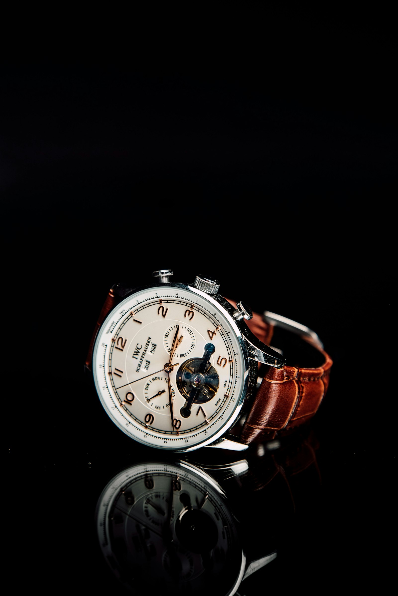 IWC chronograph with a white dial, blued hands and small seconds on a brown leather strap