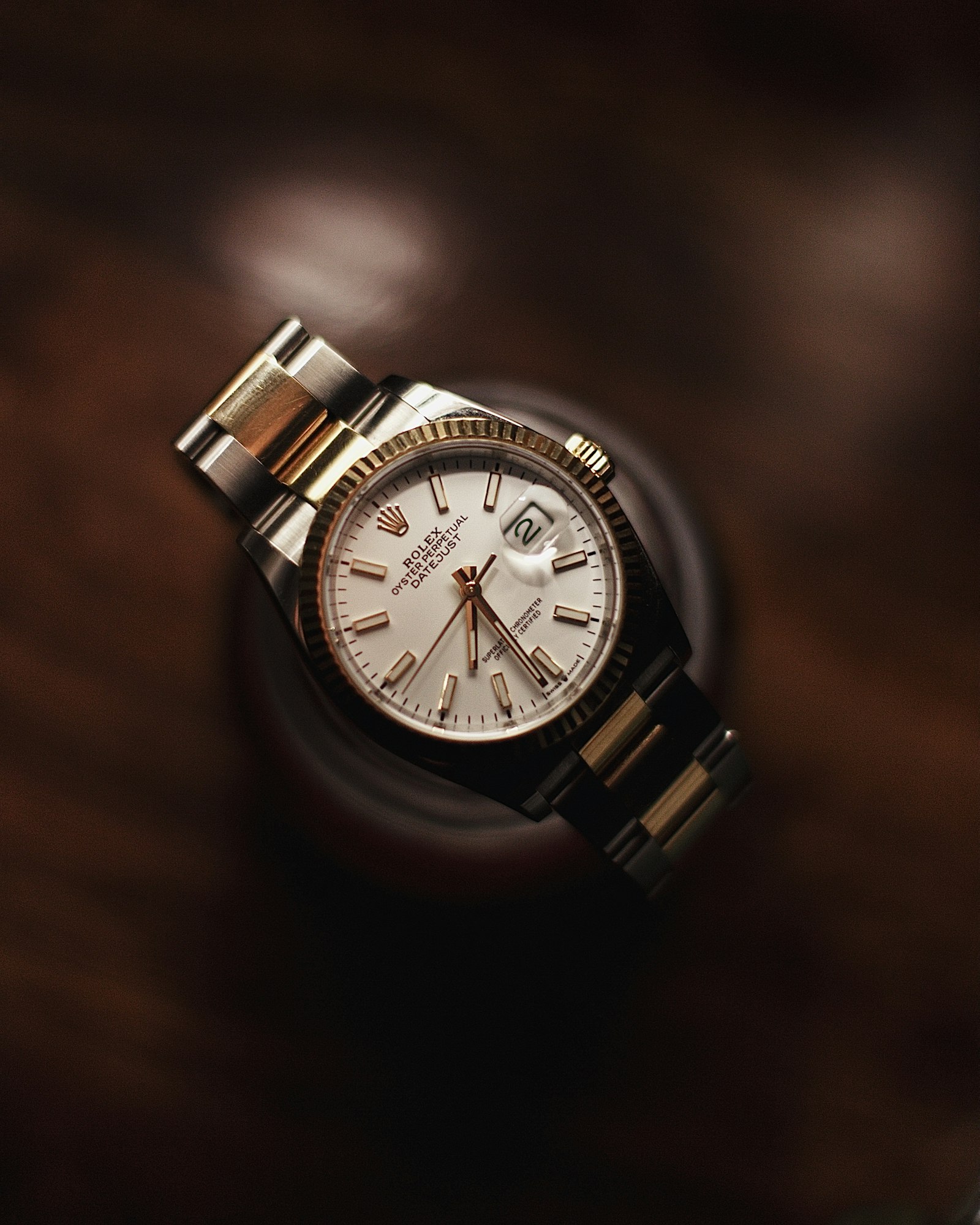 Two-tone Rolex Datejust with a fluted bezel and a silver dial